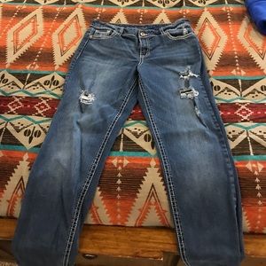 EUC distressed Maurice’s straight leg jeans.